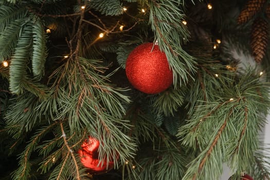 Christmas trees decorated with red balloons in front of the cafe entrance. Street Christmas decorations