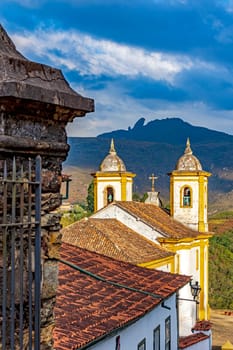 Historic baroque church in the city of Ouro Preto in Minas Gerais, with the mountains in the background