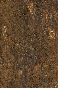 Detailed view of a canvas with acrylic paint and sand