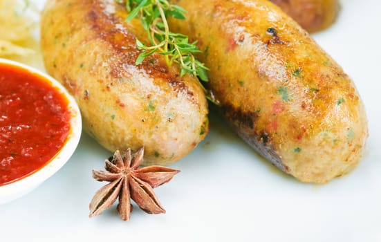 Italian Sausage with wegetables on dish and ketchup
