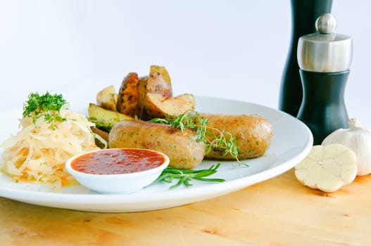 Italian Sausage with wegetables on dish and ketchup