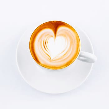 cappuccino cup with drawing on scum on white background