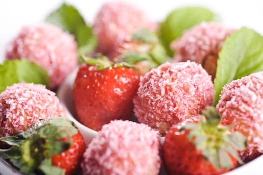 Piece of cake on plate with berries and fruits