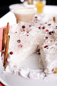 Piece of cake on white plate with milk cocktaile