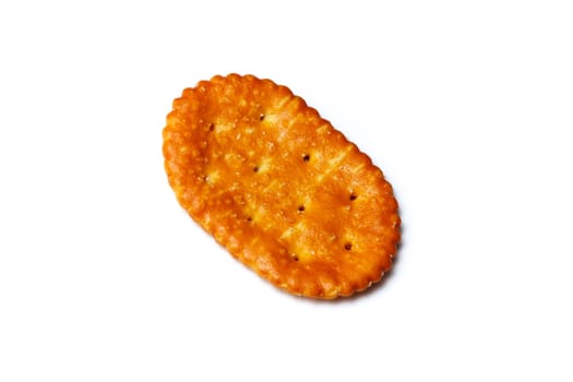 A baked cracker, cookie or biscuit over white.
