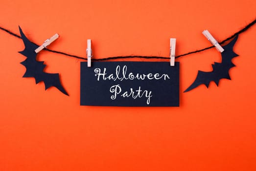 Black Label with the Words Halloween Party on Orange Background