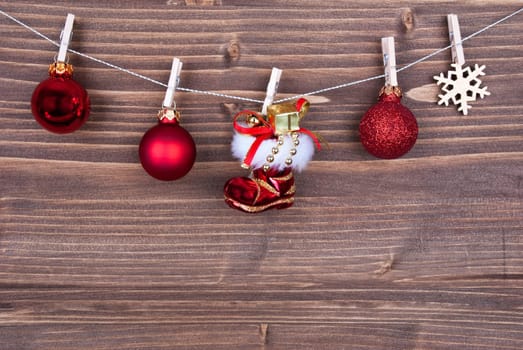 Christmas Background on Wood with Christmas Decoration Hanging on a Line