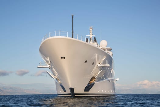 Gigantic big and large luxury mega or super motor yacht on the blue ocean.