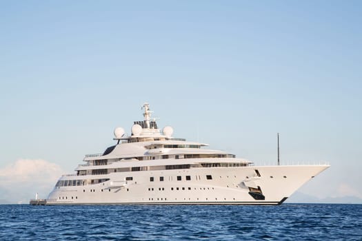 Gigantic big and large luxury mega or super motor yacht on the blue ocean.
