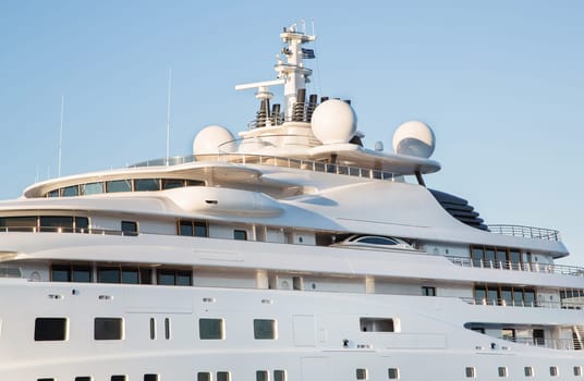 Gigantic big and large luxury mega or super motor yacht on the blue ocean.