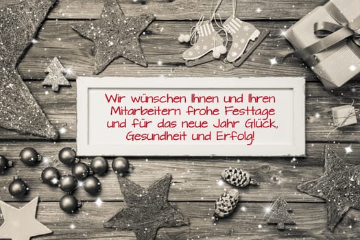 Greeting card for christmas with german text for merry christmas. Idea for employees and customers in red fonts.
