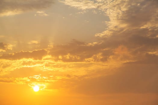 Sky Sunset dreams - sunrise on cloudy yellow and orange background.