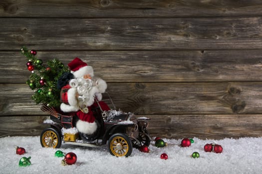 Funny wooden christmas background with santa claus for a voucher or coupon.
