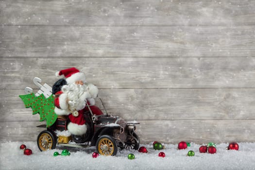 Santa claus in rush with his car