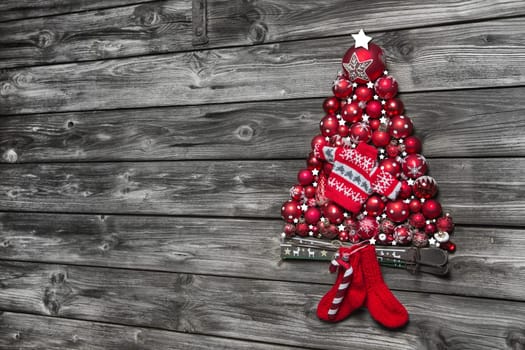 Christmas background of wood decorated with a tree of red advent balls.