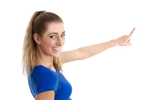 Isolated young woman in blue shirt presenting with her forefinger on white background.