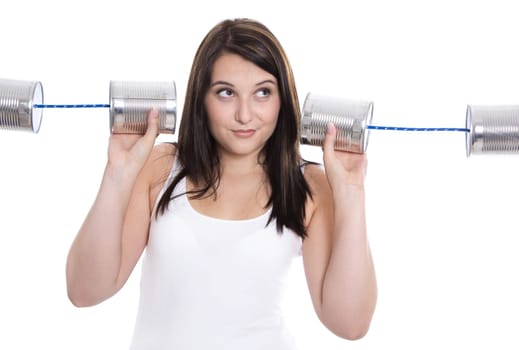 Isolated young woman in white holding tin can. Communication or decision concepts.