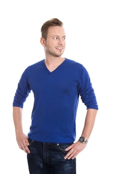 Isolated young attractive blond man in blue pullover looking sideways to text.