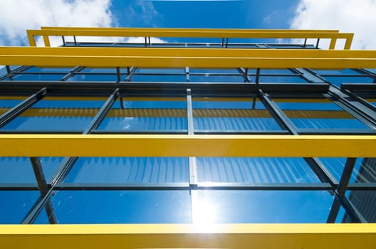 exterior of a modern office building with yellow decorations