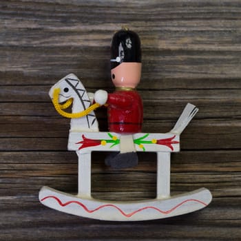 One wooden rocking horse with rider for christmas decoration.