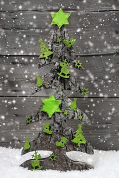 Handmade christmas tree with green decoration of felt in shabby style.