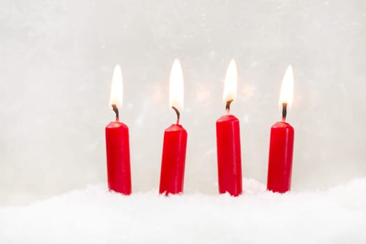 Four red candle on white background first the first advent of christmas
