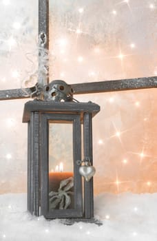 Close up of wooden lantern on window sill for a christmas greeting card