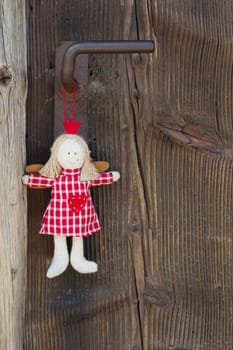 Crown angel hanging on door handle for christmas decoration with wood in country style