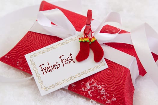 Close up of red present box with german text for christmas