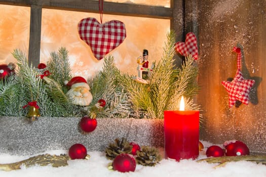 Rustic lantern with candlelights for christmas - classic decoration in red and white - country style window