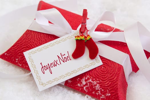 Close up of red present box with french text for christmas