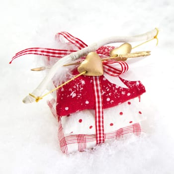 Three bean bag with ribbon and golden bow on white background for christmas