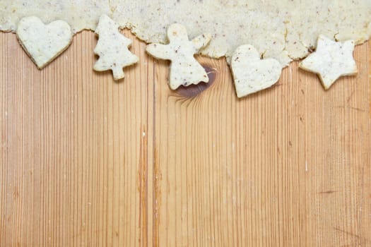 White Christmas decoration with cookies on wooden background for a rustic greeting card