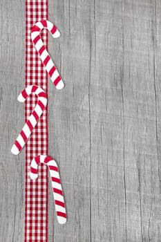 Top view of lollipop decoration on wooden background for christmas - idea for decoration or for a greeting card