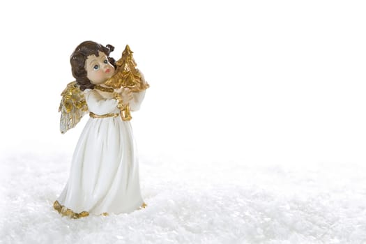 White golden christmas angel for decoration - isolated on white background with snow for a greeting card