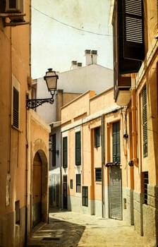 Narrow street in old city of Palma de Mallorca, Spain