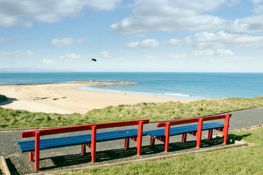 a beautiful path with benches with views of Ballybunion beach and coast