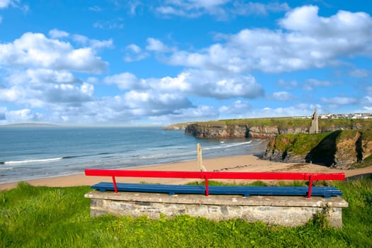 bench on a cliff edge  with views of Ballybunion beach cliffs and castle