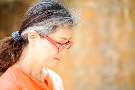 Portrait of serene mature woman in garden for adv or others purpose use