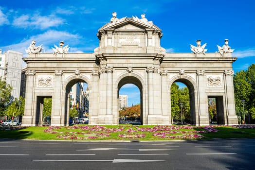 The Puerta de Alcala is a monument in the Plaza de la Independencia ("Independence Square"") in Madrid, Spain. It was commissioned by King Carlos III, with construction beginning in 1778."
