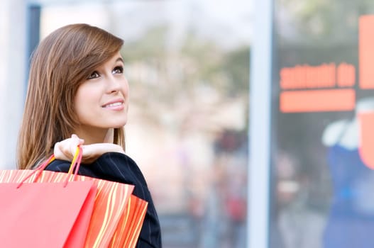 Young woman with shopping bags