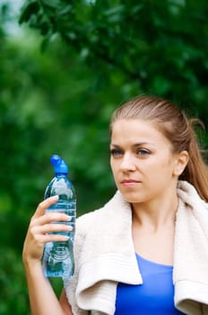 Young woman holding water bottle