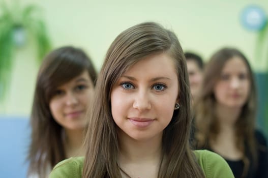 Cute student with her classmates