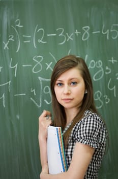 Student girl in looking at camera
