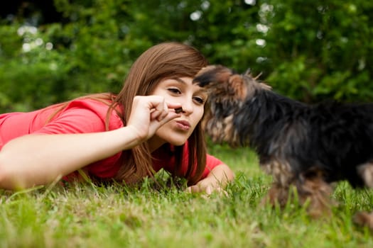 Woman feeding puppy