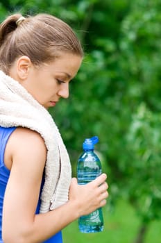 Beauty woman holding bottle of water