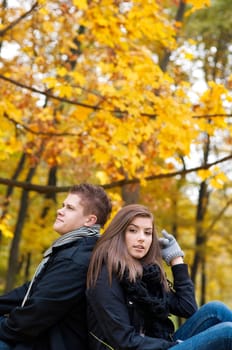Young couple sitting in park