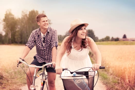 Happy couple riding bicycles