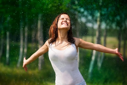 Happy young woman enjoying in nature