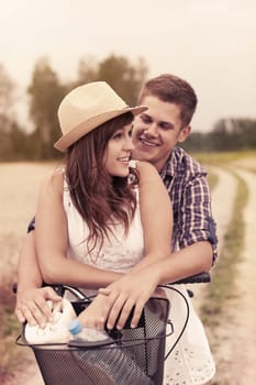 Young couple having fun on bicycle